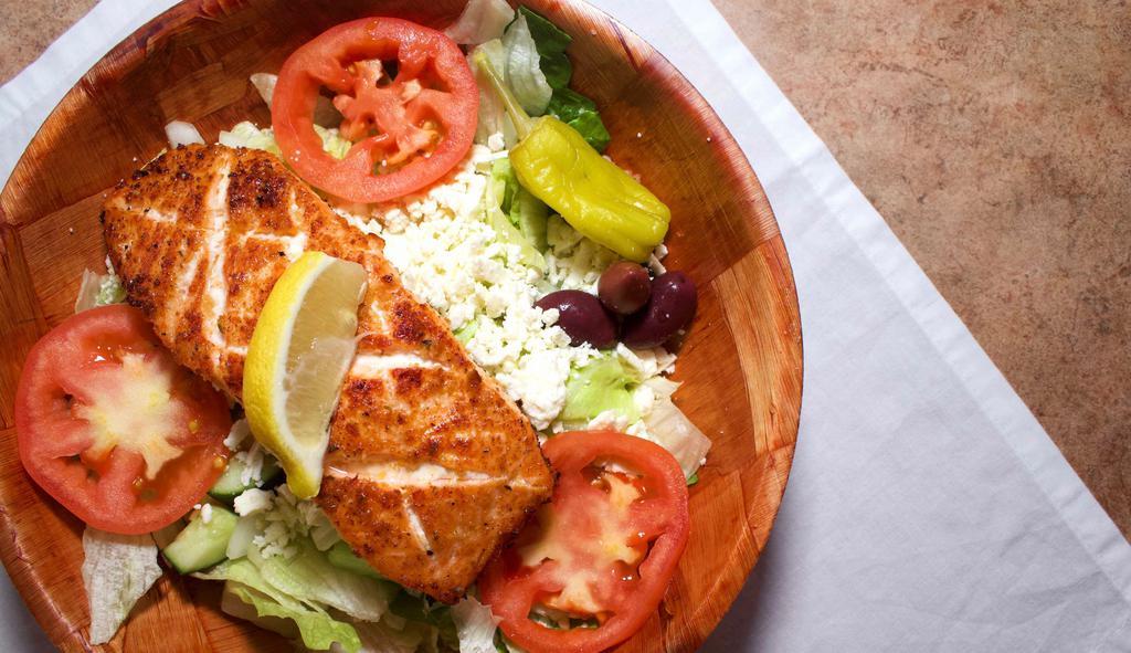 Salmon Greek Salad Combo · Broiled salmon fillet served on a bed of lettuce and Romaine, tomato, pepperoncini, Kalamata olive, feta, onions, cucumber, and green pepper. Served with Greek vinaigrette dressing. Comes with your choice of beverage and a side of challah bread.