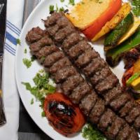 House Kabob (Koobideh) · A skewer of our juicy minced beef sirloin charbroiled.