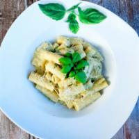 Rigatoni Pasta · Tube-shaped pasta, Italian sausage, portobello mushrooms, white truffle oil, and white cream.