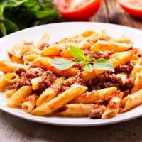 Penne Bolognese Pasta · Cylinder-shaped pieces of pasta, homemade beef bolognese smothered in fresh made tomato sauce.