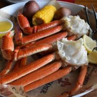 Steamed Or Boiled Snow Crab Legs · Two clusters with corn & potatoes.