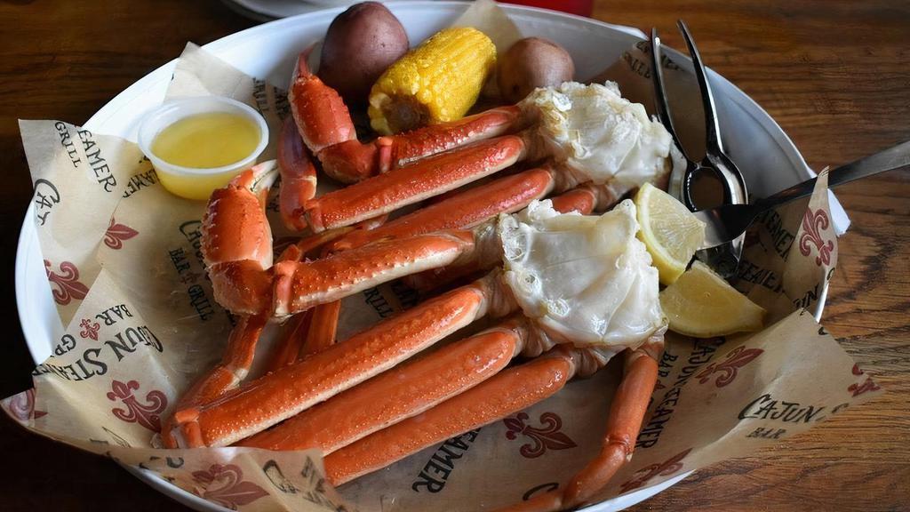 Steamed Or Boiled Snow Crab Legs · Two clusters with corn & potatoes.