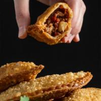 Empanada · Home-made. Fried pastry stuffed with Cuban style ground beef and potatoes (Picadillo), Shred...
