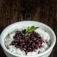 Rice & Beans · Perfect Duo. Our homemade garlic infused white rice topped with our cuban style black beans.
