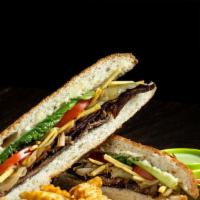 Pan Con Bistec · Delicioso! Thin cut grilled steak and sautéed mojo onions with melted swiss cheese, potatoes...