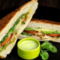 Veggie Sandwich · Toasty & Fresh. Bell pepper and onions sautéed with homemade cuban mojo topped with melted s...