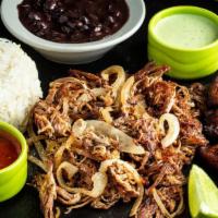 Vaca Frita · Juicy and crispy. Cuban style shredded beef grilled with homemade mojo and onions.