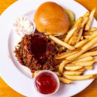 Bbq Pulled Pork · House-made sauce, pickles, coleslaw, brioche bun.