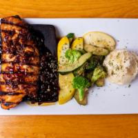 Cedar Roast Salmon · On cedar plank, citrus rum molasses glaze, fries and vegetables.