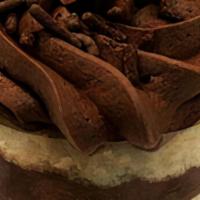 Chocolate Mousse Cake  · Layers of moist vanilla cake sandwiched with creamy chocolate mousse and finished with dark ...