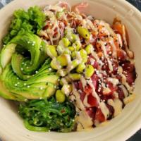 Tokio Poke · Sushi rice, tuna, salmon, kanikama, seaweed salad, tempura flakes, avocado, cucumber, scalli...