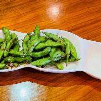 Garlic Edamame · Japanese soy beans steamed than tossed with fresh garlic bits!
