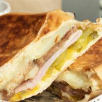 Cuban Sandwich · Roasted pork, ham and Swiss cheese with pickles, mustard and garlic aioli.