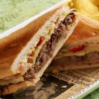 Vaca Frita Melt Sandwich · Crispy pulled beef, melted Pepper Jack cheese, grilled onions and peppers and garlic aioli.