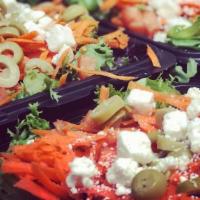 Mixed Greens Salad · Shredded carrots, chopped tomatoes, green olives and Feta cheese.