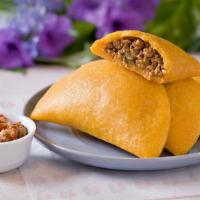 Colombian Empanada · Colombian Turnover made of crunchy cornmeal dough, filled with a creamy, aromatic beef and p...