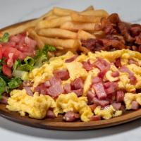 Huevos Revueltos · Scrambled eggs, ham or chopped sausage, bacon, French fries, small salad with tomatoes and l...