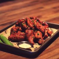 Buffalo Wings · Jumbo chicken wings fried and tossed in your choice of mild, hot, Bbq, sweet thai chili, gar...