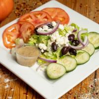 Greek Salad  · Lettuce, cucumber, tomato, feta cheese, black olives, and onions.