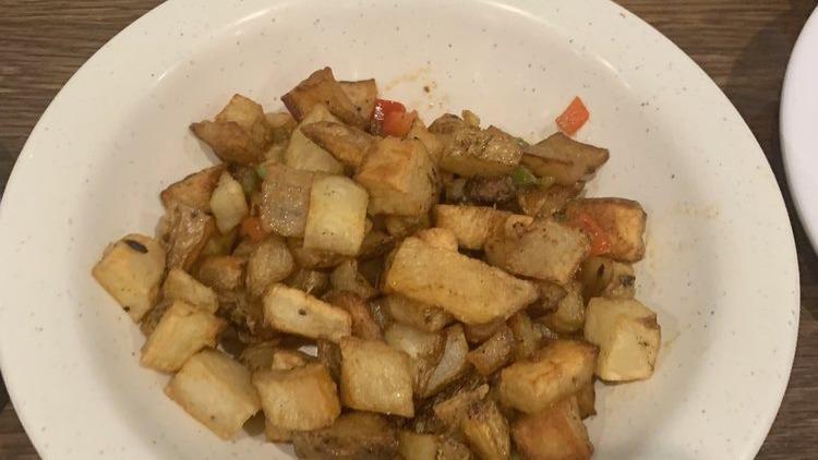 Homestyle Potatoes · Diced russet potatoes topped with sauteed onions and mixed peppers.