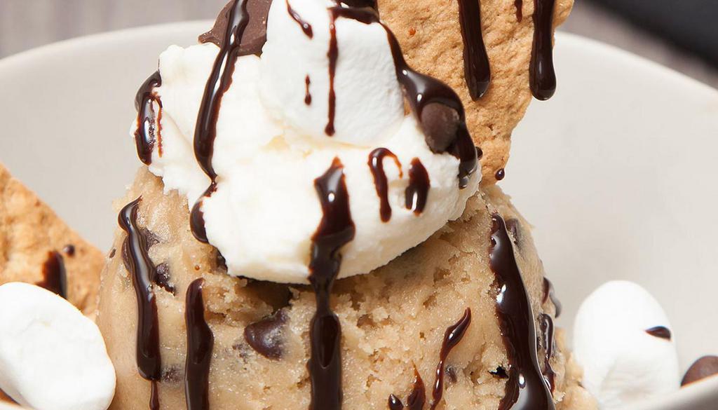 Cookie Dough Scoop - S’Mores* - Cinnadoodle Scoop · our homemade cookie dough topped with a dollop of marshmallow frosting, marshmallows, graham cookies and chocolate sauce