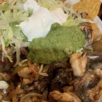 Fajita Nachos · Fajita-style steak or chicken grilled with bell peppers, onions and tomatoes.