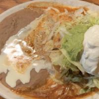 Chimichanga · Flour tortilla deep fried or soft with your choice of beef tips, shredded chicken, or ground...