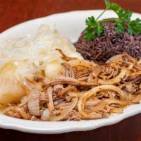Vaca Frita - Fried Beef · A flavorful flank steak cooked on the grilled, topped with sauteed onions.