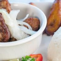Masas De Cerdo - Pork Chunks · Deep fried pork cubes until golden brown, sprinkled with mojo juice and topped with sauteed ...
