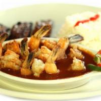 Shrimp Creole  - Camarones Enchilados · Shrimp sauteed in olive oil, wine and special red lightly spice creole sauce.