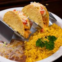 Tacos X 2 · Served with yellow rice and refried beans.