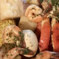 Ultimate Crab Platter · Two snow crab leg clusters, ten large shrimp, two sweet corn, four potatoes, two Cajun sausa...