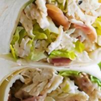 Chicken Caesar Wrap · Grilled chicken breast tossed in caesar dressing with applewood smoked bacon, romaine lettuc...