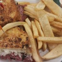 Reuben Melt · Corned beef, imported swiss cheese, and sauerkraut grilled to perfection. Served with french...
