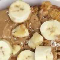 Elvis French Toast · Two thick slices French toast stuffed with peanut butter. Topped with caramelized bananas an...