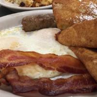 Challah French Toast · Served with two eggs, two bacon, and two sausage.