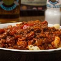 Chili Mac & Cheese · A bowl of our house made Mac & Cheese topped with our meaty chili and finished with a layer ...