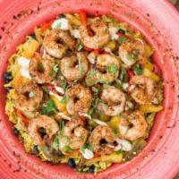 Caribbean Shrimp · We start with a huge bed of our flavorful Reggae Rice and top it with a mix of sautéed red a...