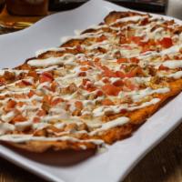 Chicken Bacon Ranch Flatbread · This flavor packed powerhouse starts with our homemade ranch base and gets topped with fresh...