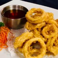 Fried Calamari · Fried, battered calamari rings served with tangy plum sauce and ground peanuts.