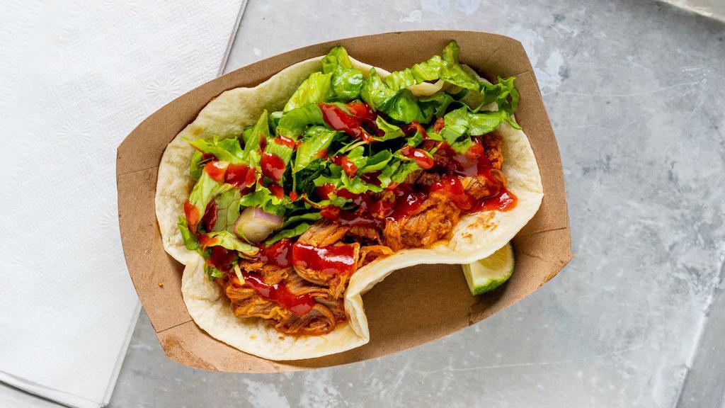 Spicy Pulled-Pork Taco · Served with our famous Yumbii chili sauce and soy-sesame vinaigrette salad.