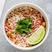 Mexican Corn · Topped with chipotle aioli, cotija cheese, lime, Yumbii chili flakes, and cilantro.