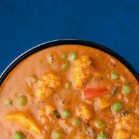 Assorted Veggie Curry · A combination of garden-fresh mixed vegetables simmered in tomato-based gravy, onion, and sp...