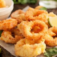 Fried Calamari · Lightly battered, tender and delicious. Served with tomato sauce and lemon.