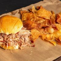 Pulled Pork Sandwich · Slow-smoked all natural pork, hand pulled and piled high.