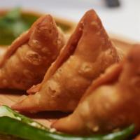 Samosa (2) · Vegetarian. Fried potatoes pastry, served with chutney.