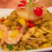 Pineapple Curry Fried Rice · Stir-fried jasmine rice in mild yellow curry, fresh pineapple, onion, bell pepper, raisins, ...