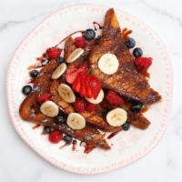 Nutella French Toast · Topped with assorted berries, nutella, and chocolate drizzle.