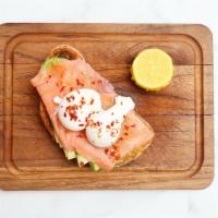 Salmon · Two poached eggs, smoked salmon served over multi-grain loaf topped with avocado slices, lem...