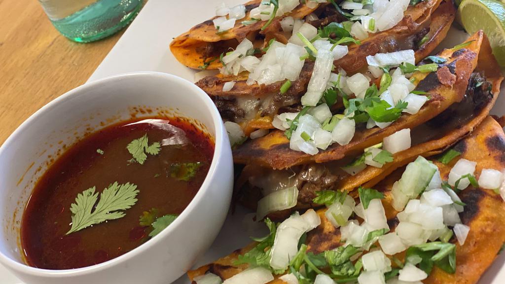 Tacos De Birria Con Queso (Birria Cheese Tacos) (Short Rib) · Short Rib on a seasoned Corn tortilla with Melted Cheese, Cilantro/Onions and lime. Order of 2 Tacos and side of soup. Hot sauce on the side